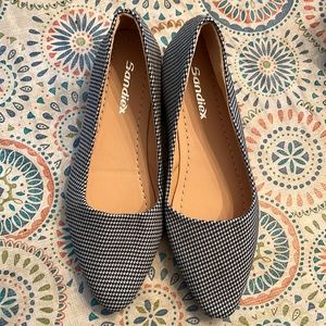 NWOB Black and white houndstooth slip on shoe with gold detail around heel.